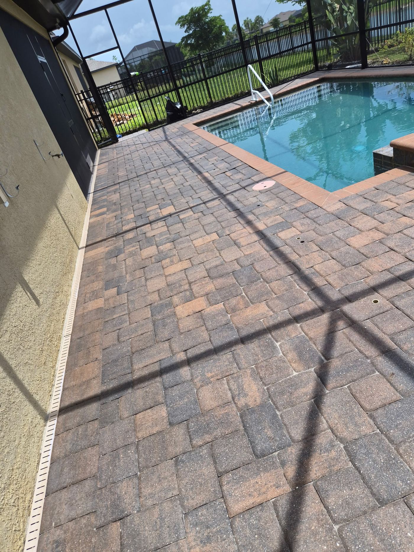 Same pool deck pavers cleaned and sealed, weed-free finish in Sarasota FL