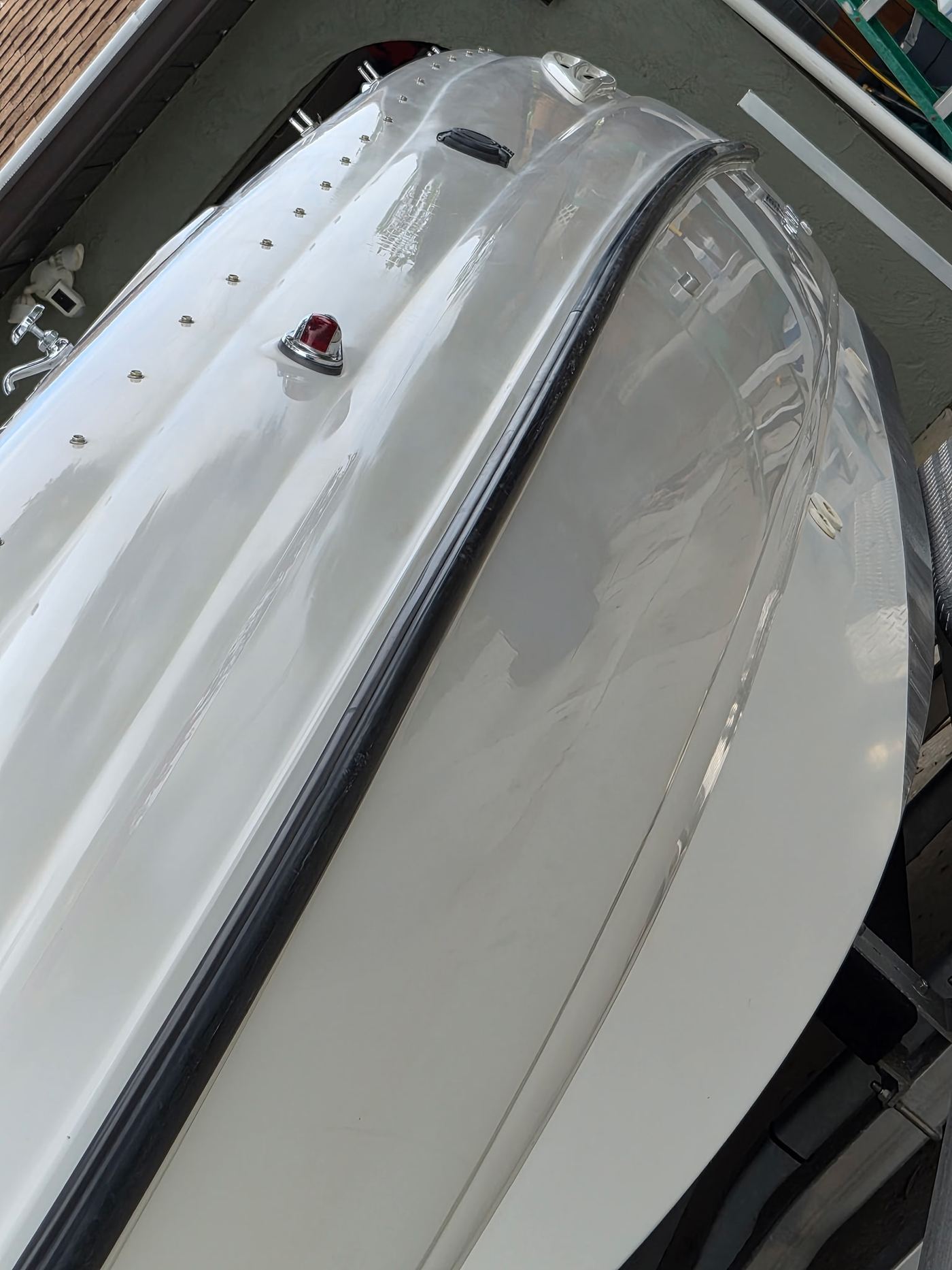 Close-up of polished boat hull after oxidation removal in Sarasota FL