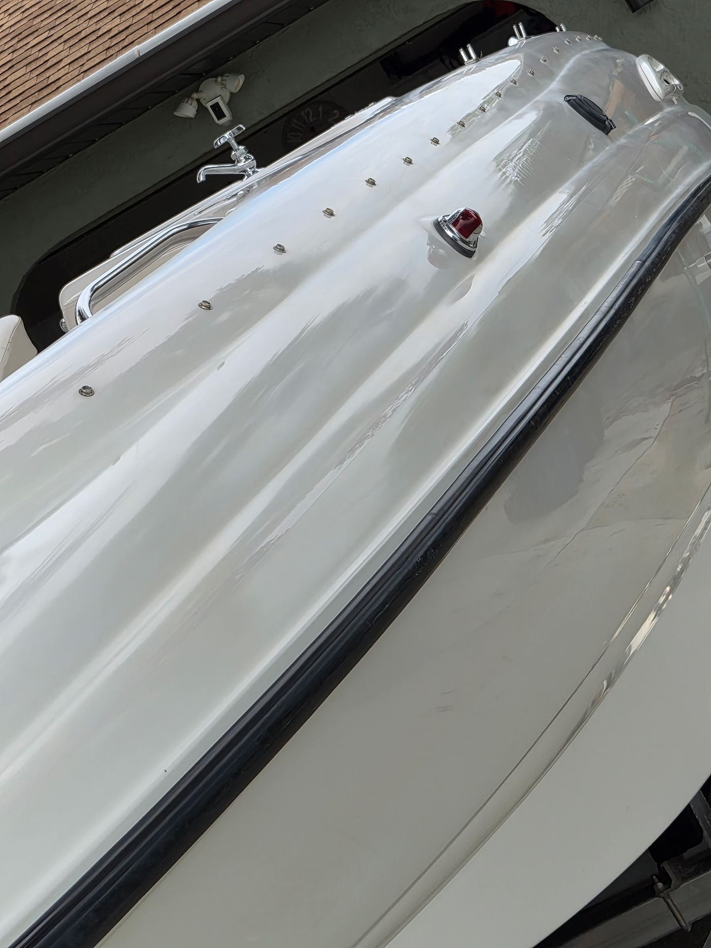 Compounded and polished boat gel coat, decals removed, Sarasota FL