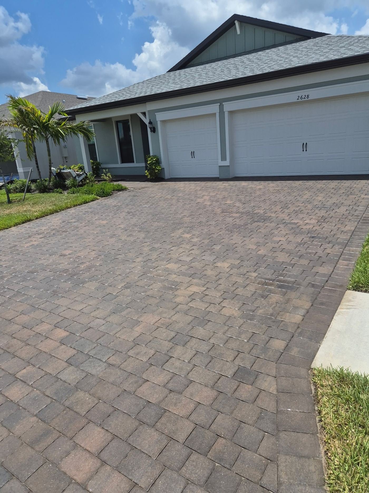 Sealed paver driveway with rich color at a Sarasota FL home