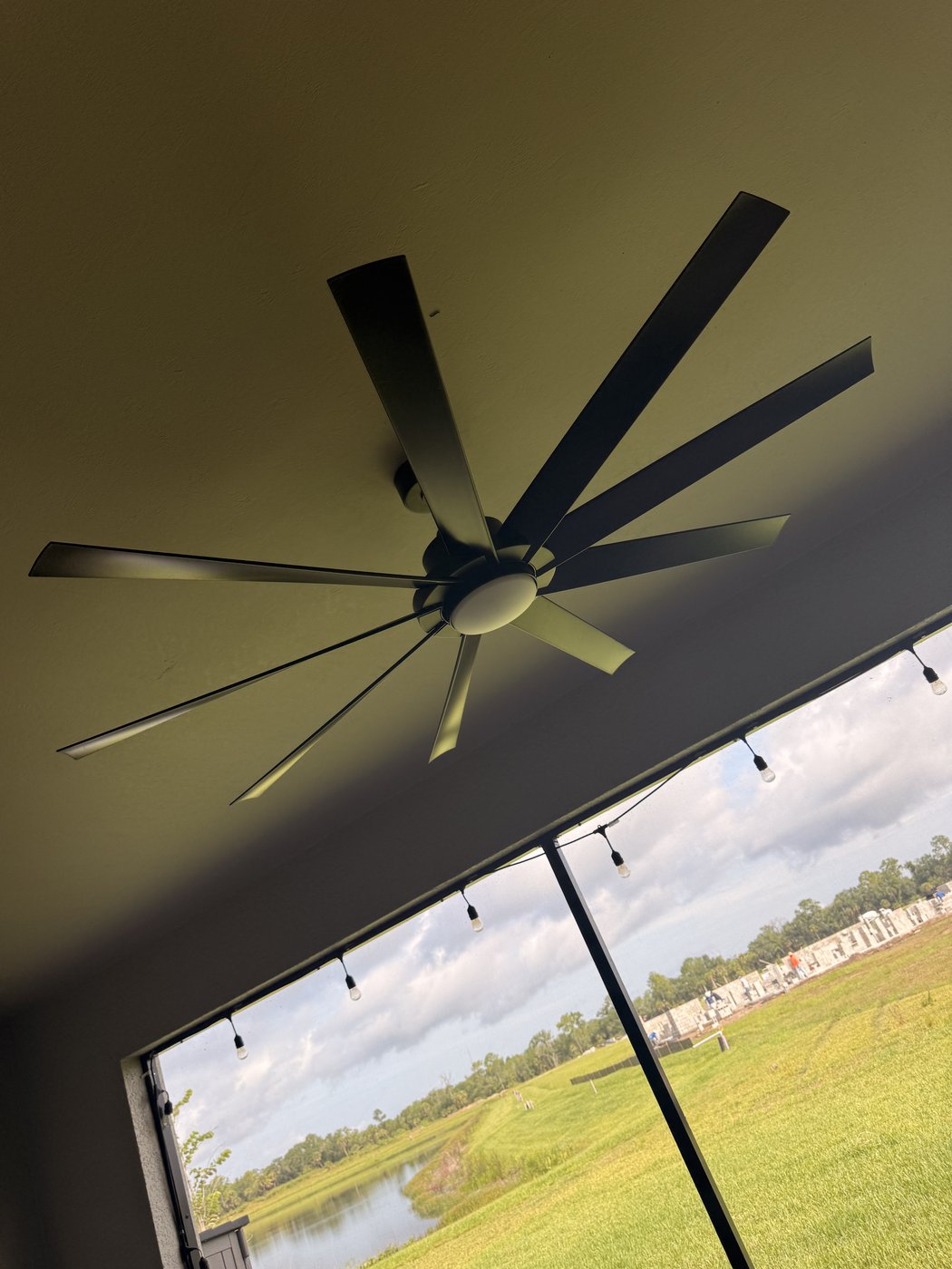 Outdoor ceiling fan installation on screened lanai in Sarasota FL