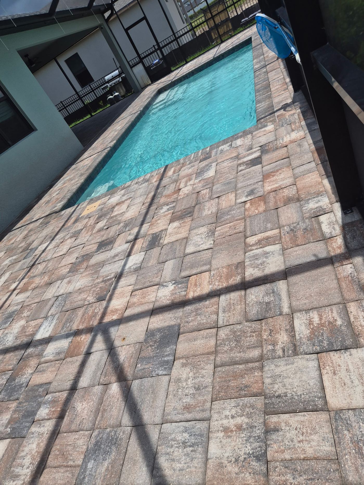 Sealed pool deck pavers alongside pool in Manatee County FL